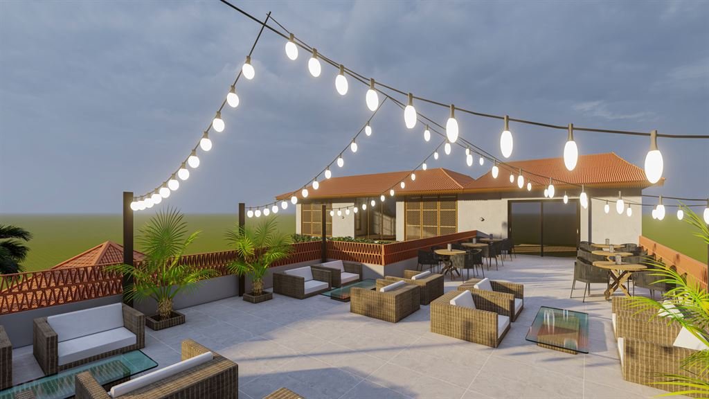 CGI render of a rooftop lounge terrace at dusk, string lights strung overhead, rattan sofas and armchairs around glass coffee tables, with the clubhouse's upper rooms and a dining area in the background.